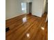 Bright bedroom features hardwood floors and a window providing natural light at 2413 Hillside Ave, Decatur, GA 30032