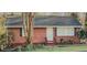 Charming brick home featuring a well-maintained lawn and inviting front entrance at 2413 Hillside Ave, Decatur, GA 30032
