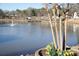 Scenic lake view featuring a charming fountain, a lakeside pier, and beautiful landscaping at 2413 Hillside Ave, Decatur, GA 30032
