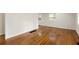 Spacious living room featuring hardwood floors and ample natural light at 2413 Hillside Ave, Decatur, GA 30032