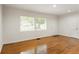 Bright living room with hardwood floors and multiple windows at 2413 Hillside Ave, Decatur, GA 30032