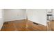 Bright living room with hardwood floors and white walls is ready for you to make it your own at 2413 Hillside Ave, Decatur, GA 30032
