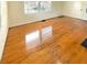 Bright living room with gleaming hardwood floors and natural light from large windows at 2413 Hillside Ave, Decatur, GA 30032