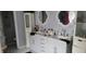 Elegant bathroom with a double sink vanity, ornate mirrors, and ample storage space for toiletries at 2453 Wall Se St, Conyers, GA 30013