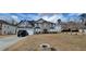 Charming two-story house with a well-manicured lawn, a two car garage, and an attractive stone facade entryway at 2453 Wall Se St, Conyers, GA 30013
