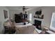 Cozy living room showcasing plush seating, an entertainment center, and a fireplace for a relaxing atmosphere at 2453 Wall Se St, Conyers, GA 30013