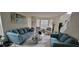 Bright living room with plush sofas, large windows, and stylish decor at 2453 Wall Se St, Conyers, GA 30013