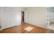 Bedroom with hardwood floors, closet, and an open doorway to the bathroom at 2826 Summit Ridge Dr, Marietta, GA 30066