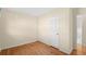 Cozy bedroom featuring hardwood floors, closet, and neutral wall color at 2826 Summit Ridge Dr, Marietta, GA 30066