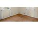 Bedroom with hardwood floors, white trim, and windows with white curtains at 2826 Summit Ridge Dr, Marietta, GA 30066