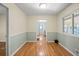Bright dining room features hardwood floors, wainscoting and a large window for natural light at 2826 Summit Ridge Dr, Marietta, GA 30066