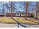 Traditional home with a brick facade and a tidy front yard situated among mature trees at 2826 Summit Ridge Dr, Marietta, GA 30066