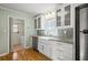 The kitchen features a stainless steel refrigerator, a farmhouse style sink, and granite counter tops at 2826 Summit Ridge Dr, Marietta, GA 30066