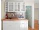 The kitchenette features white cabinets, a wood countertop, a stainless steel sink, and a gas cooktop at 2826 Summit Ridge Dr, Marietta, GA 30066