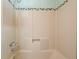 Bathroom shower with beige shower stall, tiled wall accent, and chrome shower head at 2826 Summit Ridge Dr, Marietta, GA 30066