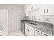 Bright kitchen with granite counters, stainless steel appliances, and white subway tile backsplash at 7007 Wingate Way, Atlanta, GA 30350