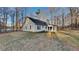 A sprawling backyard featuring lush greenery, a privacy fence, and mature trees at 285 Belmont Trl, Covington, GA 30016