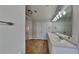 Bright bathroom with double sinks and a large mirror with vanity lighting at 285 Belmont Trl, Covington, GA 30016