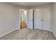 Bright bedroom featuring plush carpet flooring, a closet, and minimalist design at 285 Belmont Trl, Covington, GA 30016