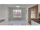 Bright dining area boasting ample natural light from a large window at 285 Belmont Trl, Covington, GA 30016