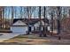 Charming single-story home featuring an attached garage and beautiful landscaping at 285 Belmont Trl, Covington, GA 30016