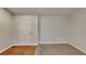 Living room with carpet flooring and neutral paint at 285 Belmont Trl, Covington, GA 30016