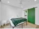 Cozy bedroom showcasing a unique green sliding barn door and neutral decor at 821 Ralph Mcgill Ne Blvd # 3104, Atlanta, GA 30306