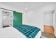 Bedroom featuring a green sliding barn door that leads to the ensuite bath at 821 Ralph Mcgill Ne Blvd # 3104, Atlanta, GA 30306