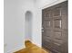 View of entryway with hardwood flooring, an arched alcove, and a dark wooden door at 821 Ralph Mcgill Ne Blvd # 3104, Atlanta, GA 30306