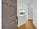 Inviting entryway featuring hardwood floors, white walls, and a glimpse into the open-concept living space at 821 Ralph Mcgill Ne Blvd # 3104, Atlanta, GA 30306
