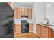 Kitchen features stainless steel appliances, light wood cabinets, and a white tile backsplash at 821 Ralph Mcgill Ne Blvd # 3104, Atlanta, GA 30306