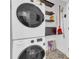 Modern laundry room showcasing stacked washer and dryer units and patterned tile at 821 Ralph Mcgill Ne Blvd # 3104, Atlanta, GA 30306