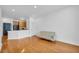 Bright living room featuring hardwood floors and open layout to the kitchen at 821 Ralph Mcgill Ne Blvd # 3104, Atlanta, GA 30306