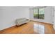 Bright living room featuring hardwood floors and a large window that brings in natural light at 821 Ralph Mcgill Ne Blvd # 3104, Atlanta, GA 30306