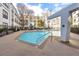 The pristine community pool features a water fountain, surrounded by modern architecture and a relaxing atmosphere at 821 Ralph Mcgill Ne Blvd # 3104, Atlanta, GA 30306