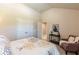Inviting bedroom with plush chair, side table, and window, creating a serene retreat at 113 Maplewood Ln, Conyers, GA 30094