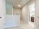 Upstairs hallway with view to bathroom that features double vanity and tiled flooring at 113 Maplewood Ln, Conyers, GA 30094