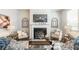 Inviting living room with a fireplace, large sofa, and decorative accents at 113 Maplewood Ln, Conyers, GA 30094