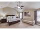 Bedroom featuring a tray ceiling, neutral color palette and furniture with soft textures and finishes at 1217 Trophy Club Ave, Dacula, GA 30019