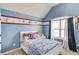 blue bedroom features a double bed, window and cartoon decor at 1217 Trophy Club Ave, Dacula, GA 30019