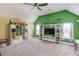 Spacious bedroom with vaulted ceilings, ceiling fan, and large built-in shelving and entertainment center at 1217 Trophy Club Ave, Dacula, GA 30019