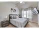 Bedroom featuring a ceiling fan, mounted TV, and contemporary decor at 1217 Trophy Club Ave, Dacula, GA 30019