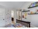 Bright bedroom with carpet features cartoon decor, shelves and an ensuite bathroom at 1217 Trophy Club Ave, Dacula, GA 30019