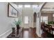 Spacious foyer showcasing hardwood floors, decorative accents, and access to dining area at 1217 Trophy Club Ave, Dacula, GA 30019