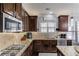 Well-equipped kitchen with granite countertops, stainless steel appliances, and stylish cabinetry at 1217 Trophy Club Ave, Dacula, GA 30019