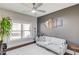 Sitting room featuring natural light, a gray futon and decor at 1217 Trophy Club Ave, Dacula, GA 30019