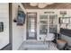 Cozy enclosed patio features a hot tub and a seating area to relax and enjoy time together at 1217 Trophy Club Ave, Dacula, GA 30019