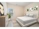 Cozy bedroom featuring stylish decor, a window and a neutral color palette at 235 Green Bridge Ct, Lawrenceville, GA 30046