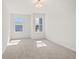 Bright bedroom with two windows offering ample natural light and neutral carpeting at 1016 Rose Dr, Marietta, GA 30060