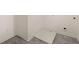 Practical laundry room with modern tile flooring and hookups at 1049 Blue Juniper Cir, Loganville, GA 30052